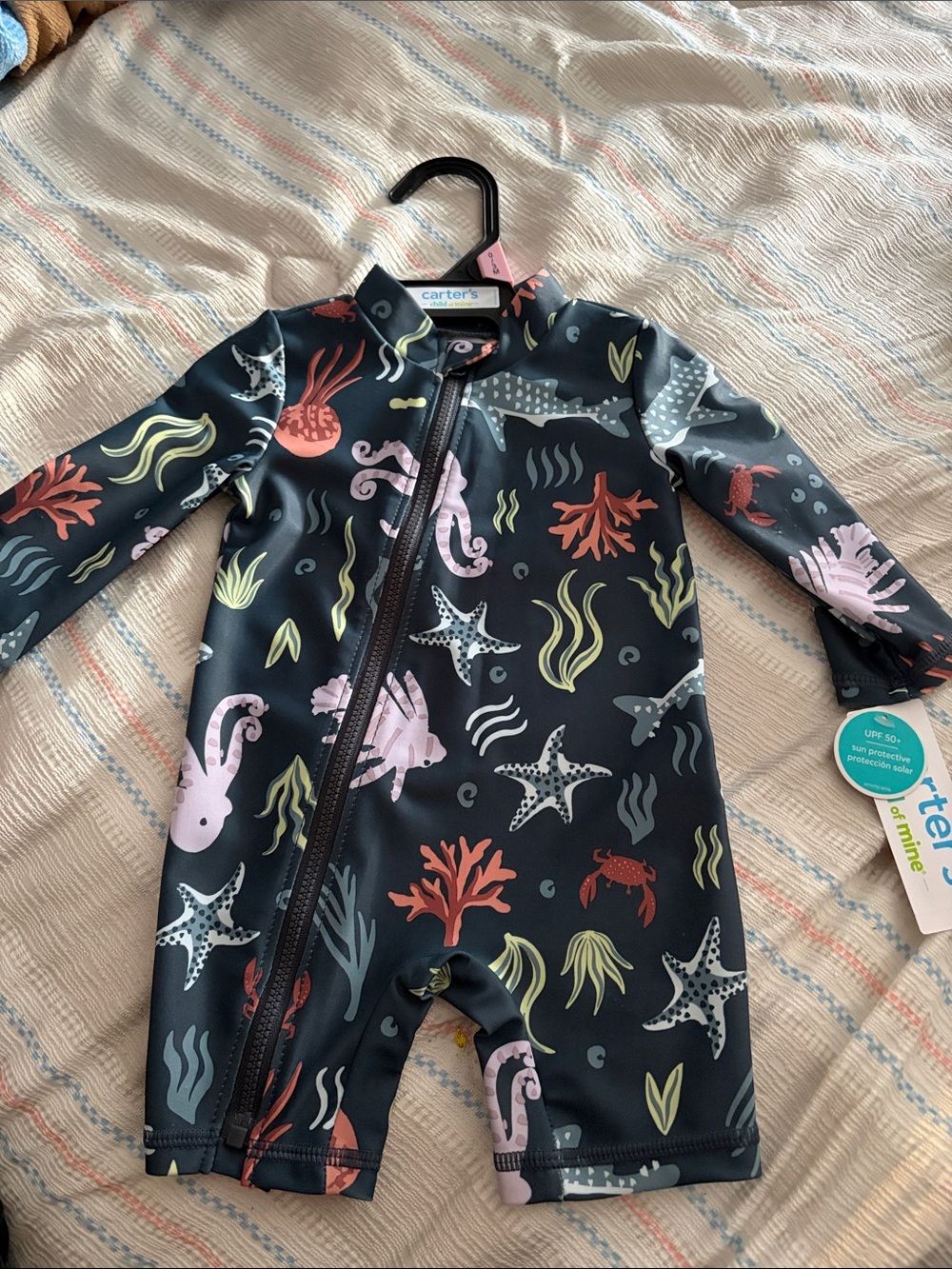 Carter's Navy Ocean Print UPF Swim Romper with Coral and Pink and orange Accents